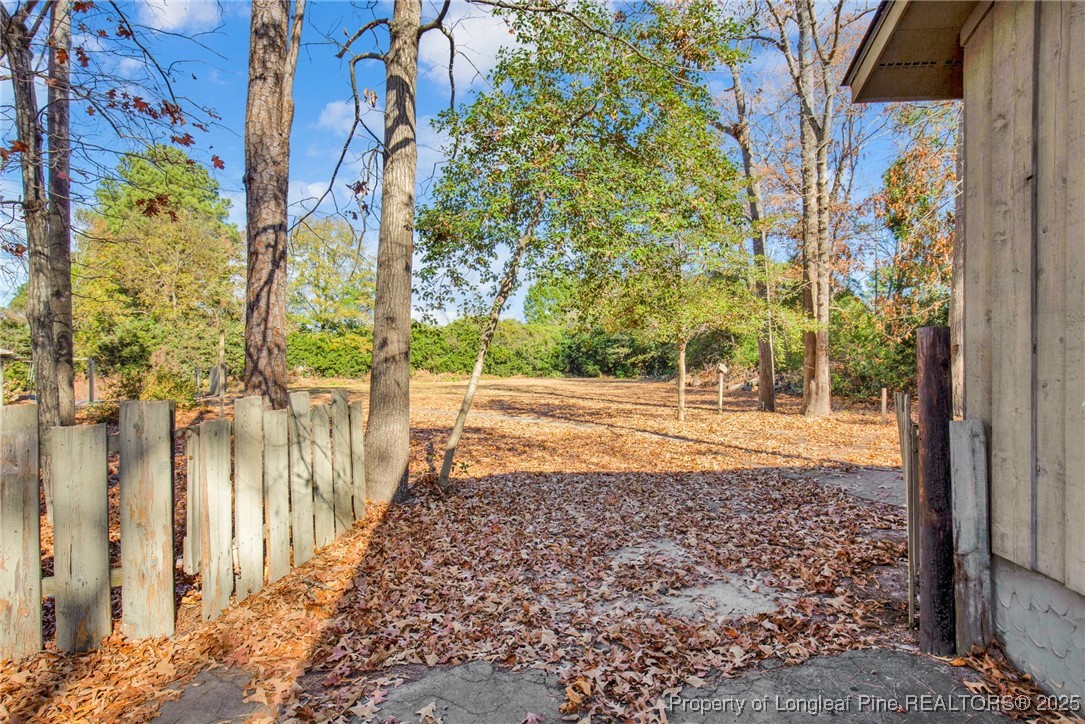549 Rainforest Road Hope Mills, NC 28348 - Photo 40 of 40 a view of a yard with plants and large trees