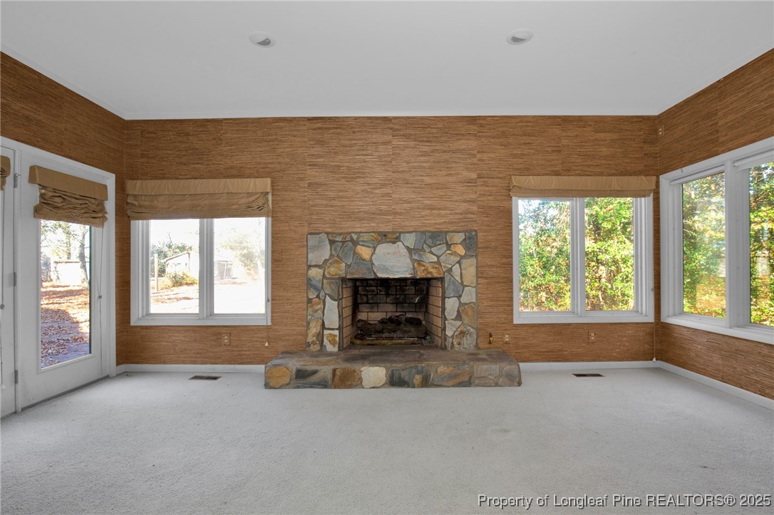 549 Rainforest Road Hope Mills, NC 28348 - Photo 5 of 40 an empty room with windows and fireplace