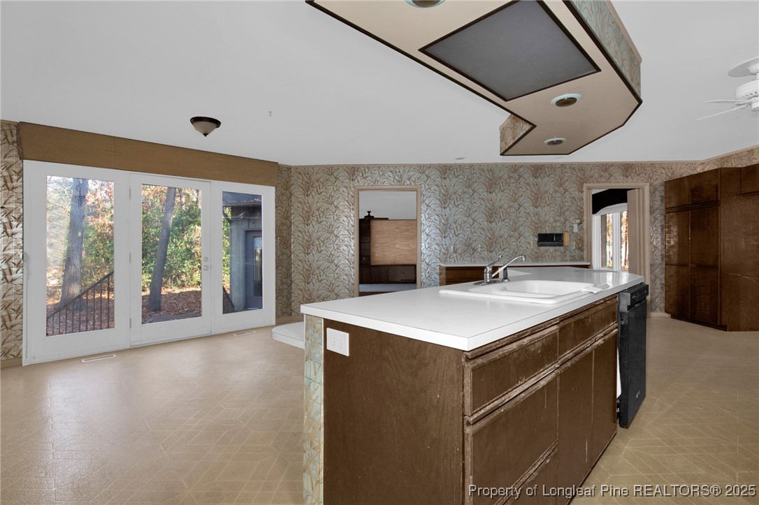 549 Rainforest Road Hope Mills, NC 28348 - Photo 8 of 40 a kitchen with a stove and a large window