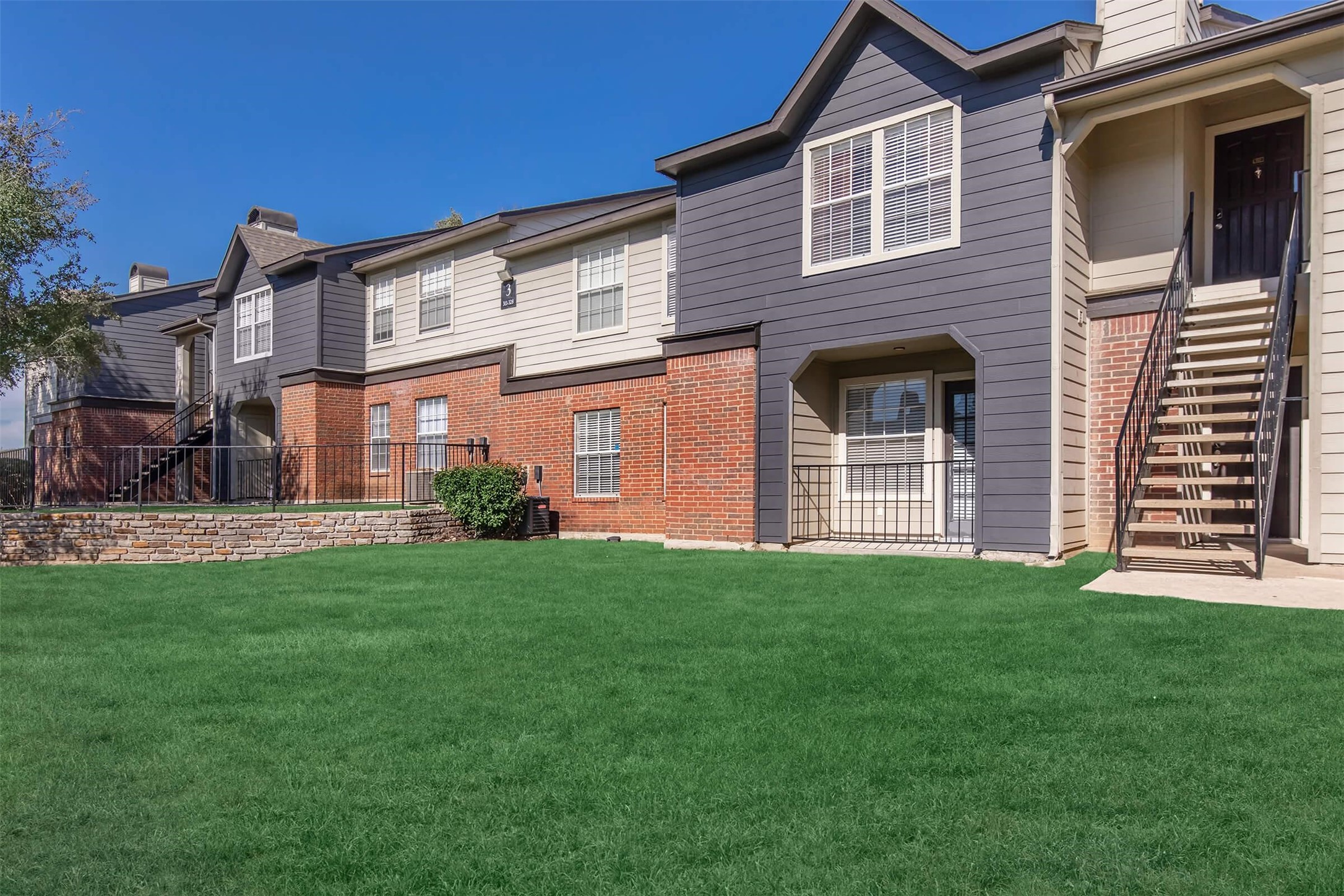 8301 Boat Club Road, Unit 1026 Fort Worth, TX 76179 - Photo 30 of 42 a front view of a house with a yard