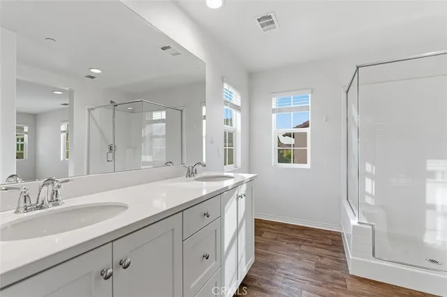 a bathroom with a granite countertop sink mirror and double