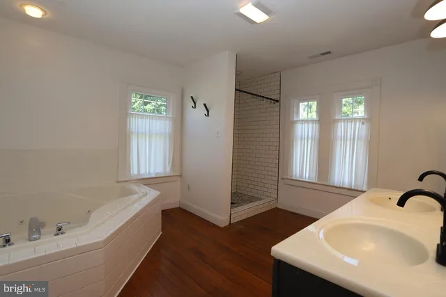 a bathroom with a bathtub and a sink