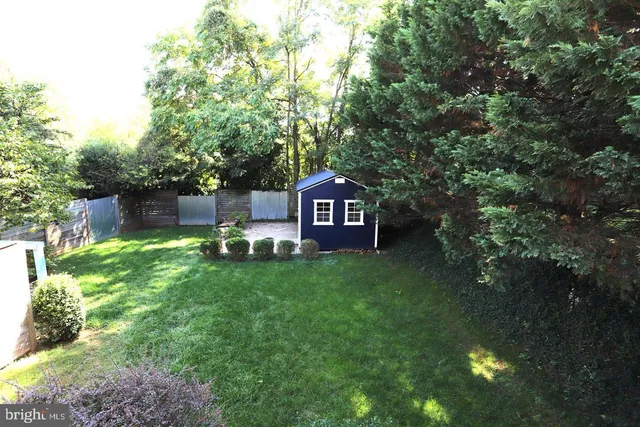 a view of a chairs in a backyard of a house