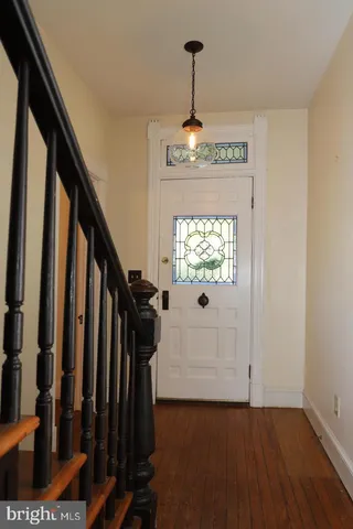 a view of entryway with wooden floor