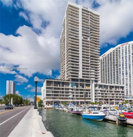 a front view of a building with swimming pool