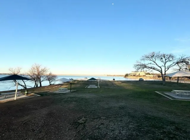 a view of grassy field with mountain