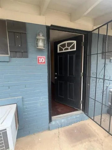 an empty room with entrance door