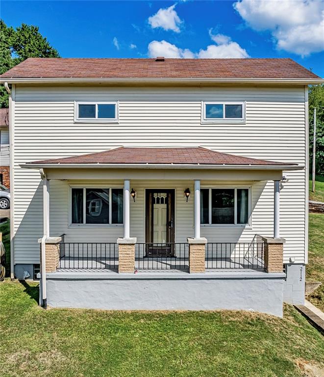 front view of a house with a yard