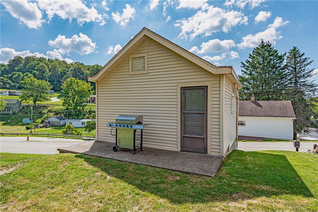 2112 Claridge Elliott Road Claridge, PA 15623 - Photo 22 of 25 a view of backyard with deck and a garden