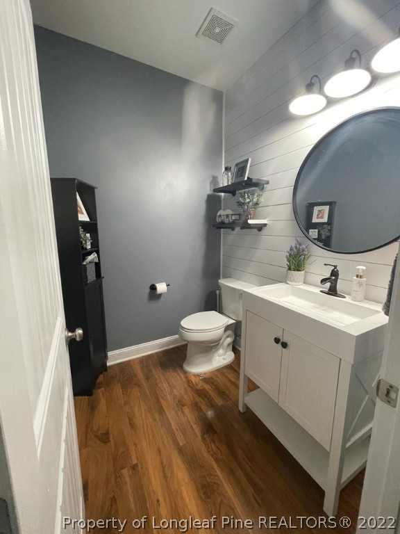 747 Sun Road Aberdeen, NC 28315 - Photo 20 of 48 a bathroom with a sink mirror vanity and toilet