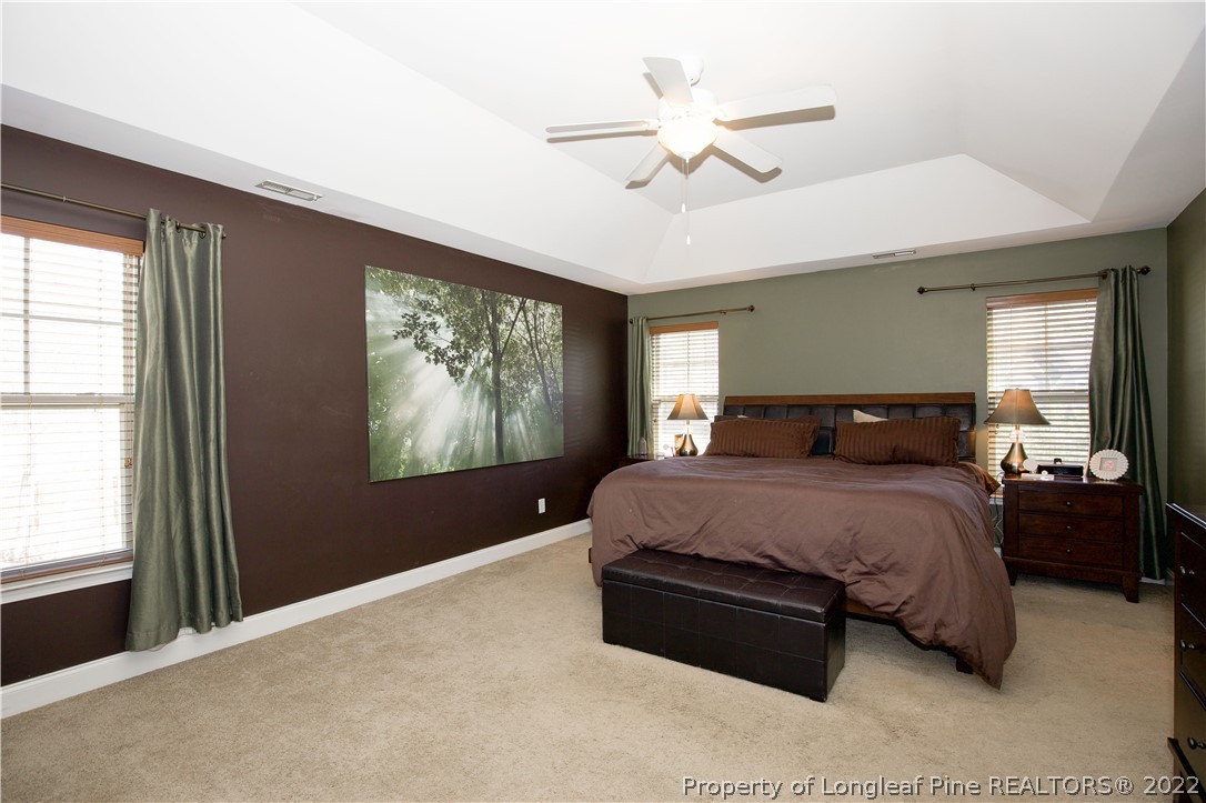 747 Sun Road Aberdeen, NC 28315 - Photo 23 of 48 a spacious bedroom with a large bed and a window