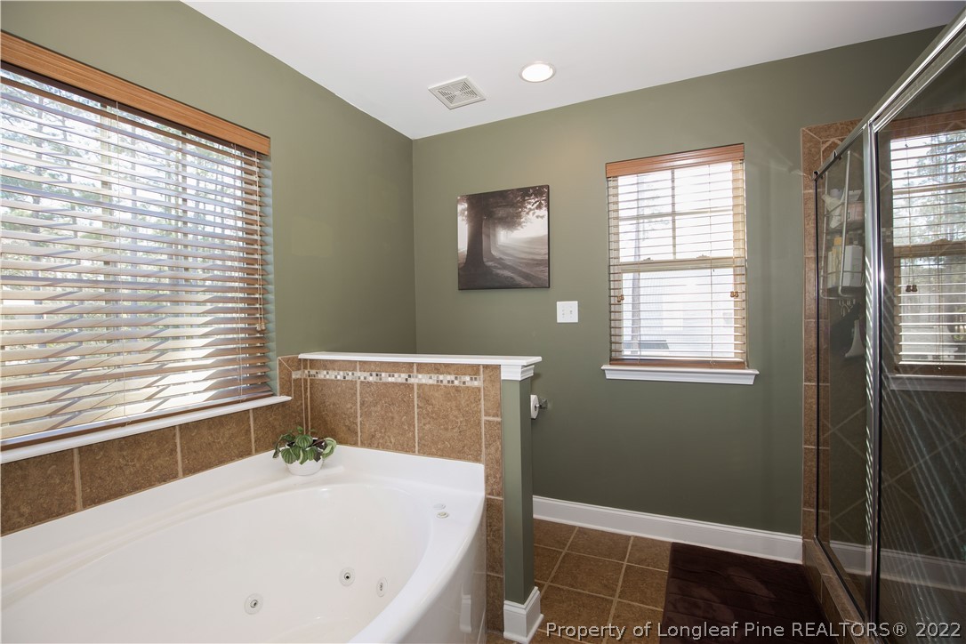 747 Sun Road Aberdeen, NC 28315 - Photo 25 of 48 a bathroom with a sink and a bathtub