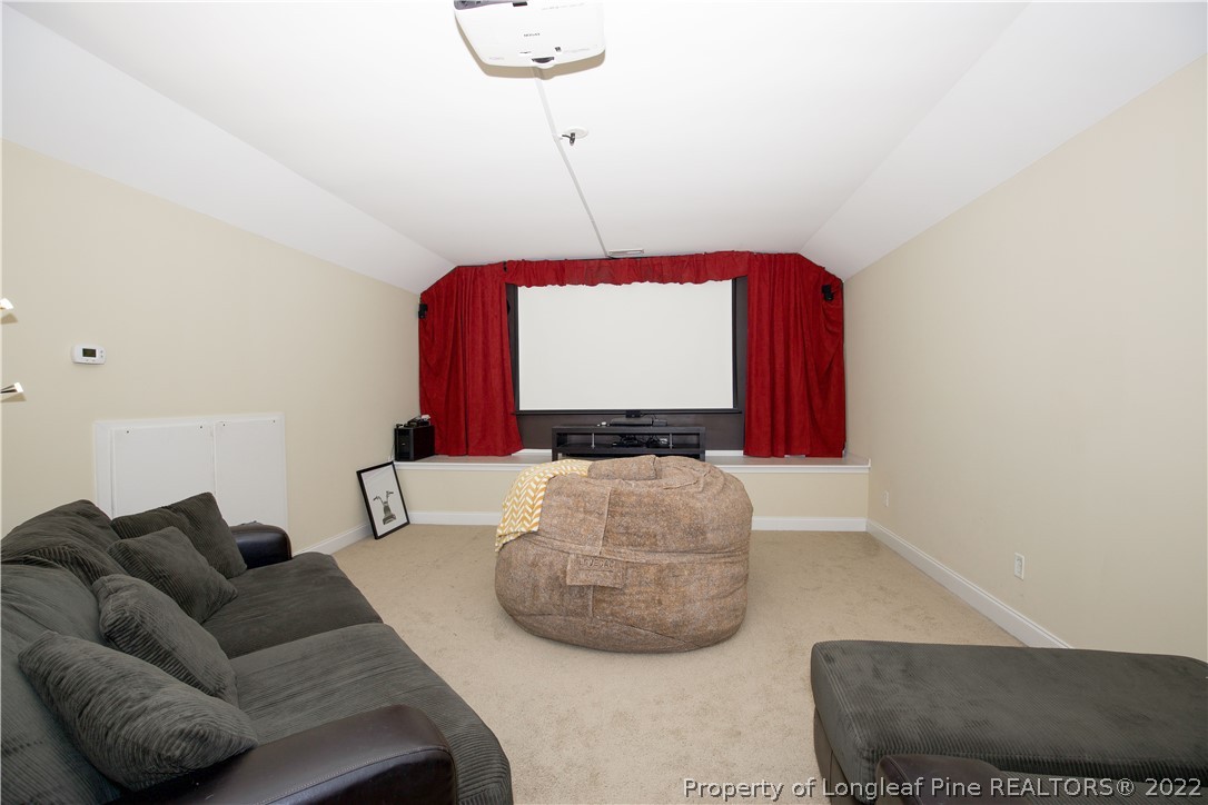 747 Sun Road Aberdeen, NC 28315 - Photo 35 of 48 a living room with furniture a rug and a window