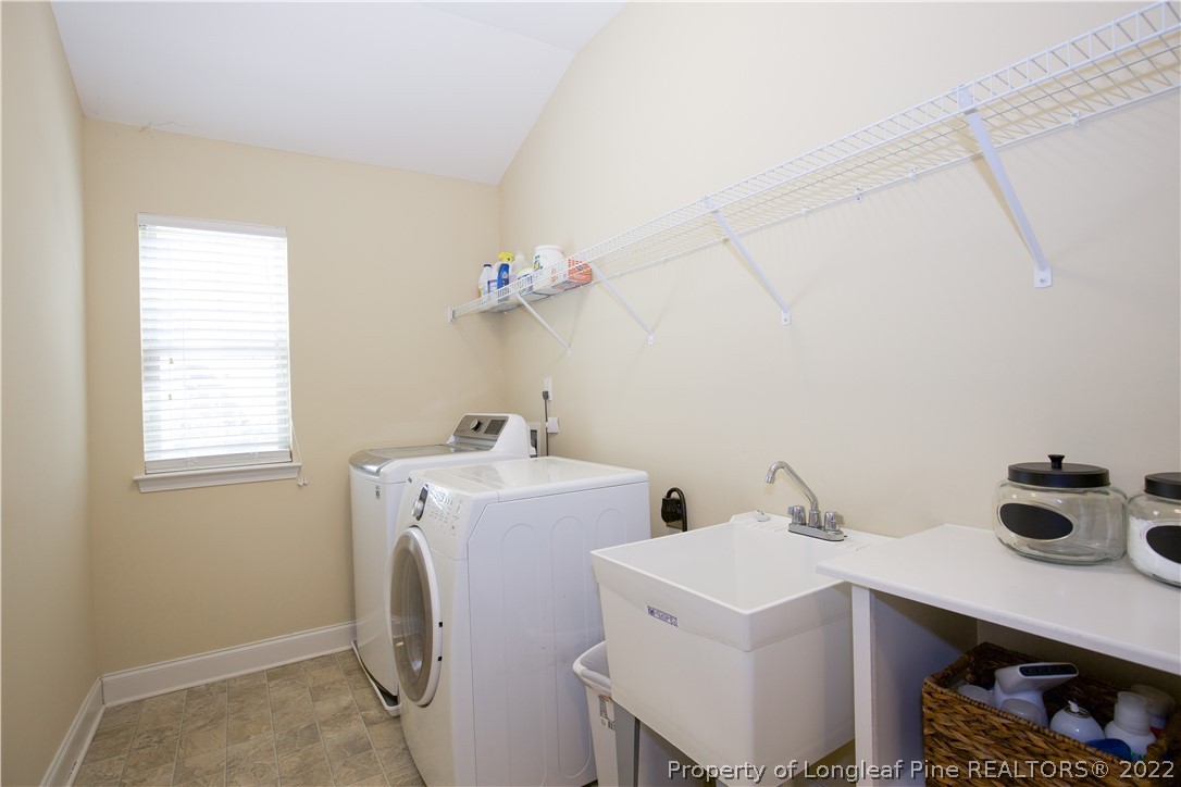 747 Sun Road Aberdeen, NC 28315 - Photo 36 of 48 a utility room with dryer and washer