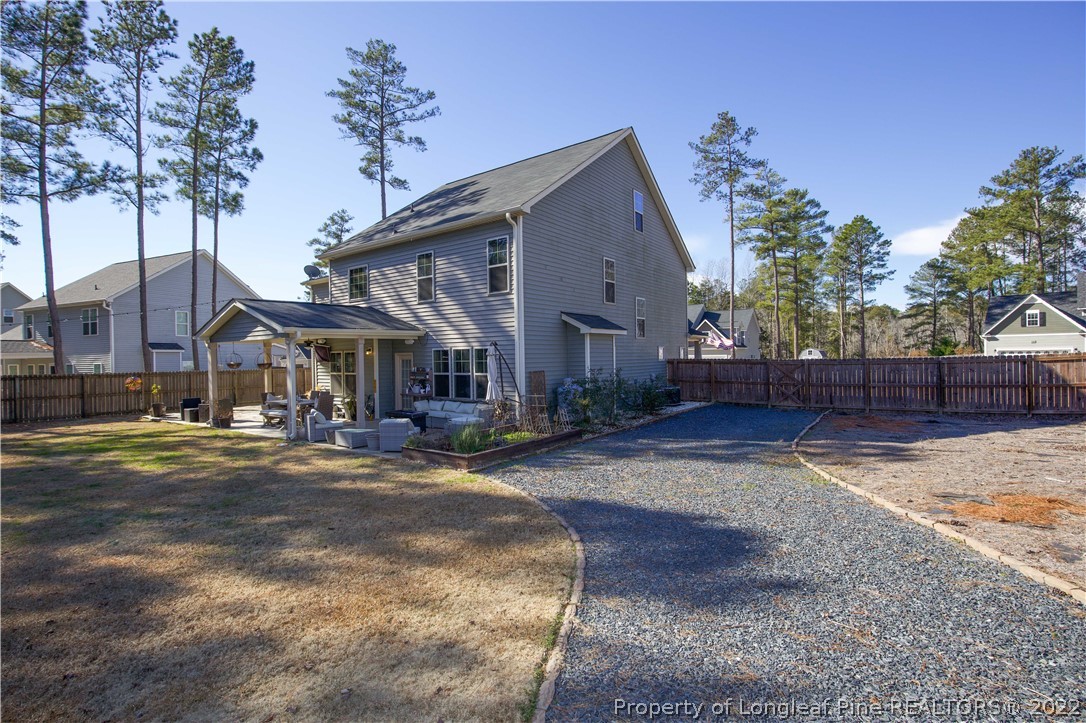 747 Sun Road Aberdeen, NC 28315 - Photo 40 of 48 a front view of a house with a yard