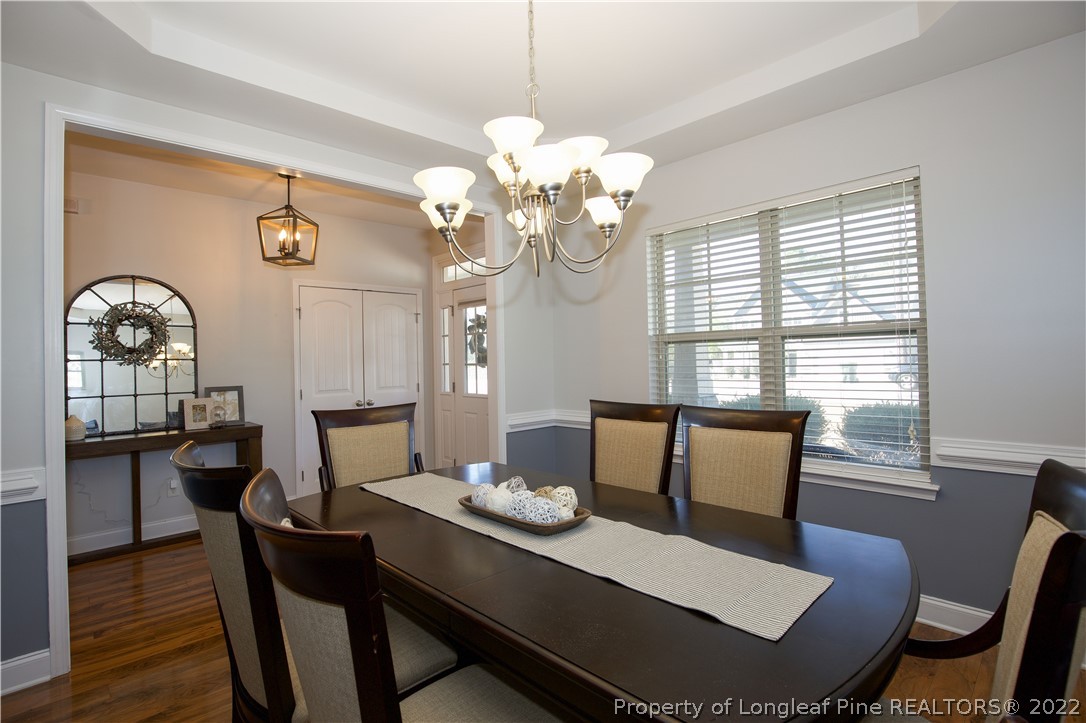 747 Sun Road Aberdeen, NC 28315 - Photo 6 of 48 a view of a dining room with furniture window and wooden floor