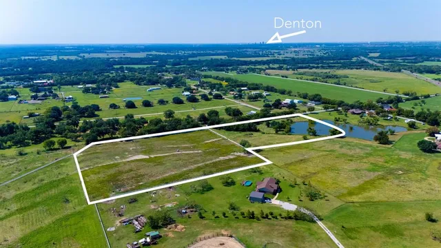 a view of a tennis ground with a swimming pool