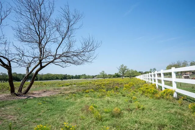 a view of a yard with an outdoor space and seating