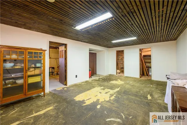 a view of an empty room with closet