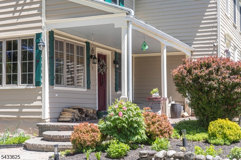 449 Stamets Road Milford, NJ 08848 - Photo 2 of 44 a front view of a house with garden