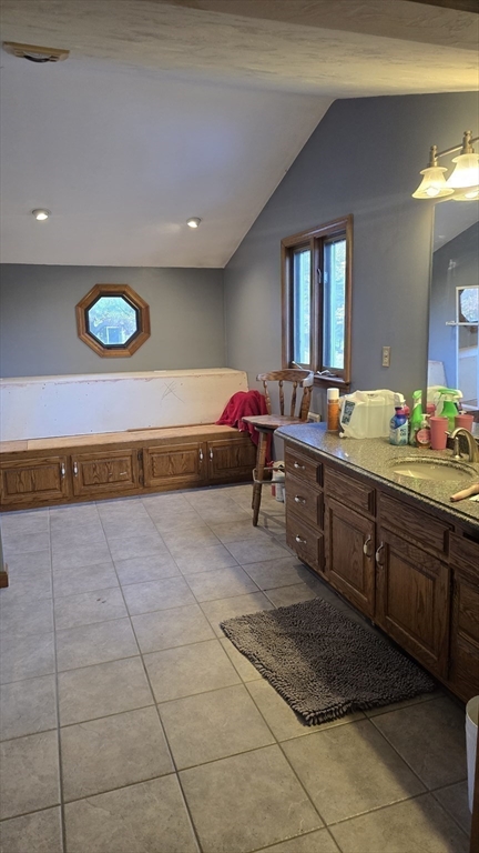 64 Village Street Millis, MA 02054 - Photo 18 of 37 a spacious bathroom with a mirror and a sink