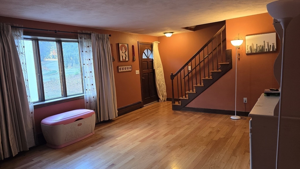 64 Village Street Millis, MA 02054 - Photo 2 of 37 a view of an entryway with wooden floor