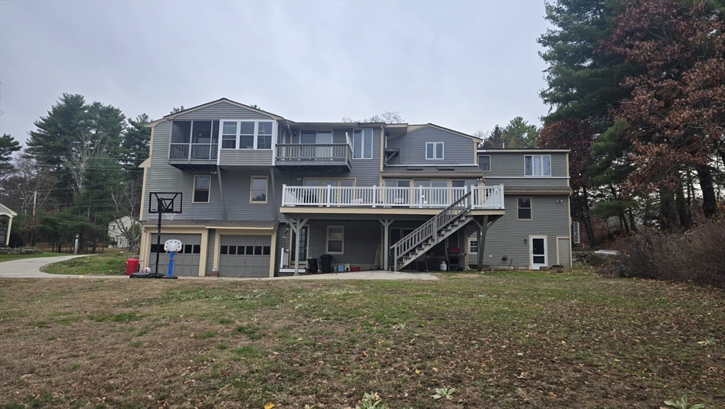64 Village Street Millis, MA 02054 - Photo 34 of 37 a view of a house with a yard and sitting area