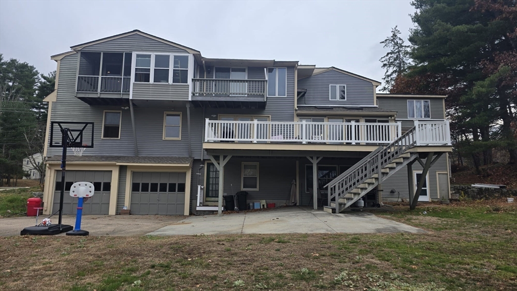 64 Village Street Millis, MA 02054 - Photo 36 of 37 a front view of a house with parking space