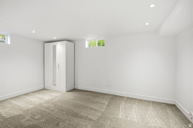 1187 East Ridgedale Circle Millcreek, UT 84106 - Photo 24 of 49 Finished room featuring light-toned carpeting, recessed lighting, and bright white walls
