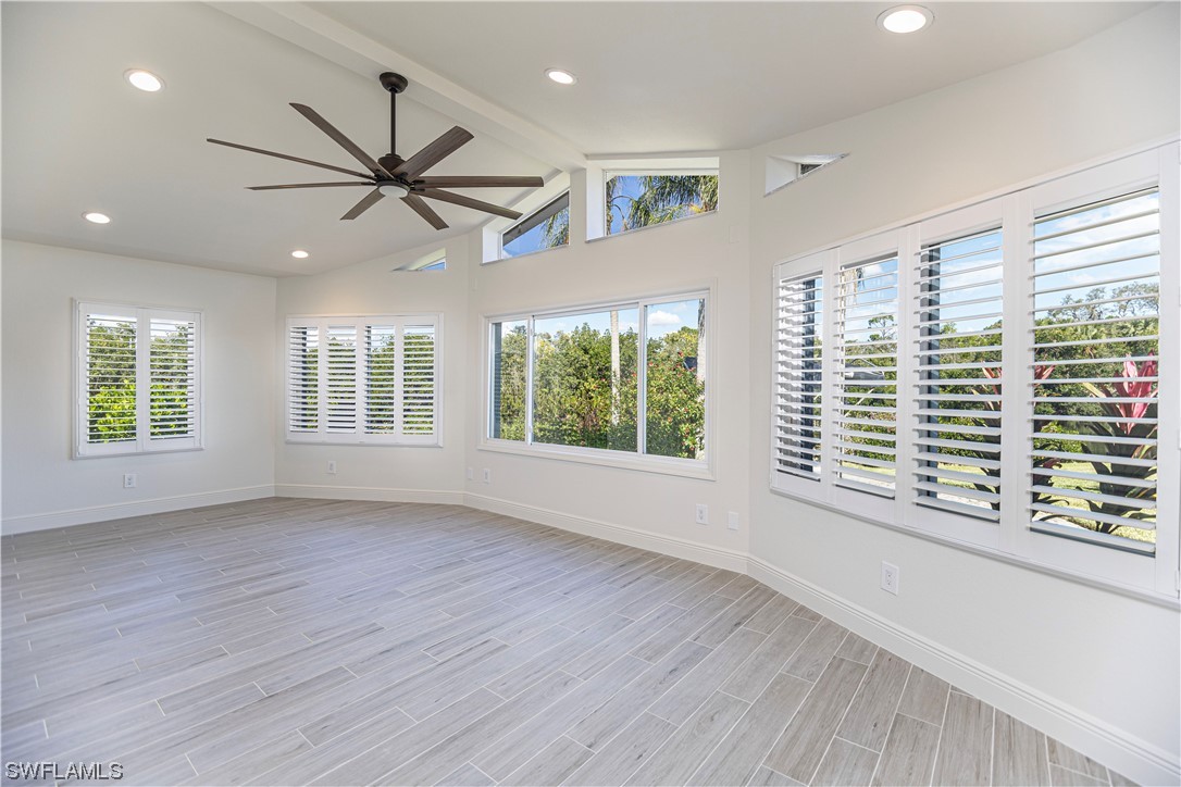 1753 Club House Road North Fort Myers, FL 33917 - Photo 11 of 24 a view of an empty room with wooden floor and a window