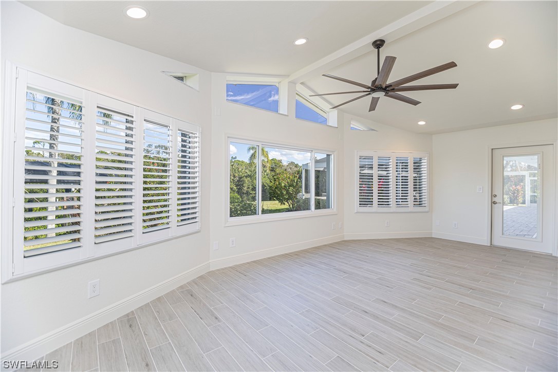 1753 Club House Road North Fort Myers, FL 33917 - Photo 12 of 24 a view of an empty room with a window and wooden floor