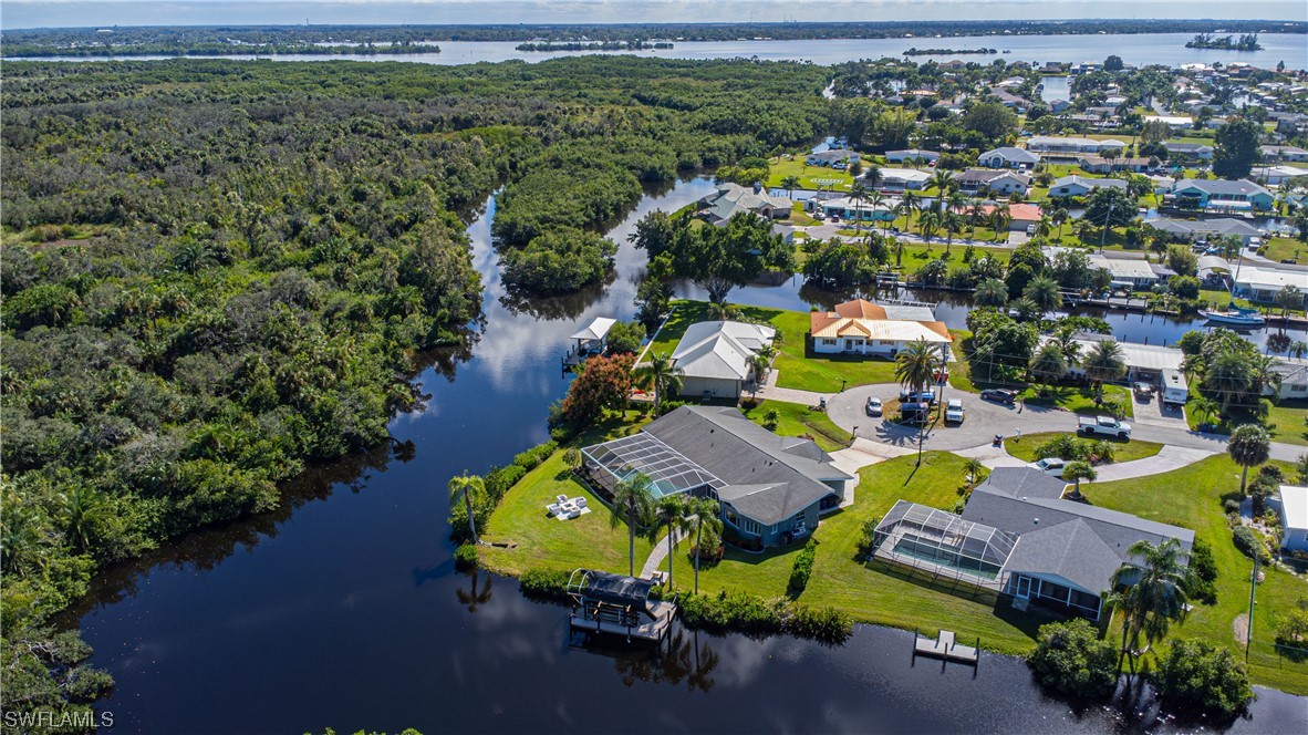 1753 Club House Road North Fort Myers, FL 33917 - Photo 2 of 24 an aerial view of a house with garden space ocean view