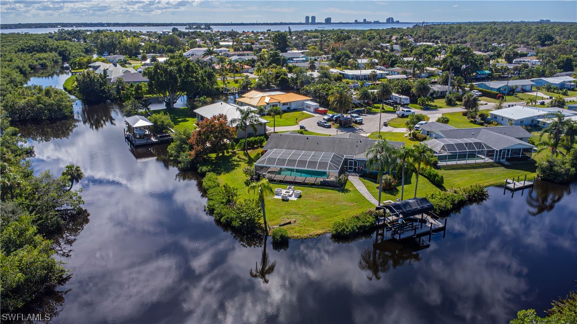 1753 Club House Road North Fort Myers, FL 33917 - Photo 3 of 24 an aerial view of a house with a swimming pool yard and outdoor seating