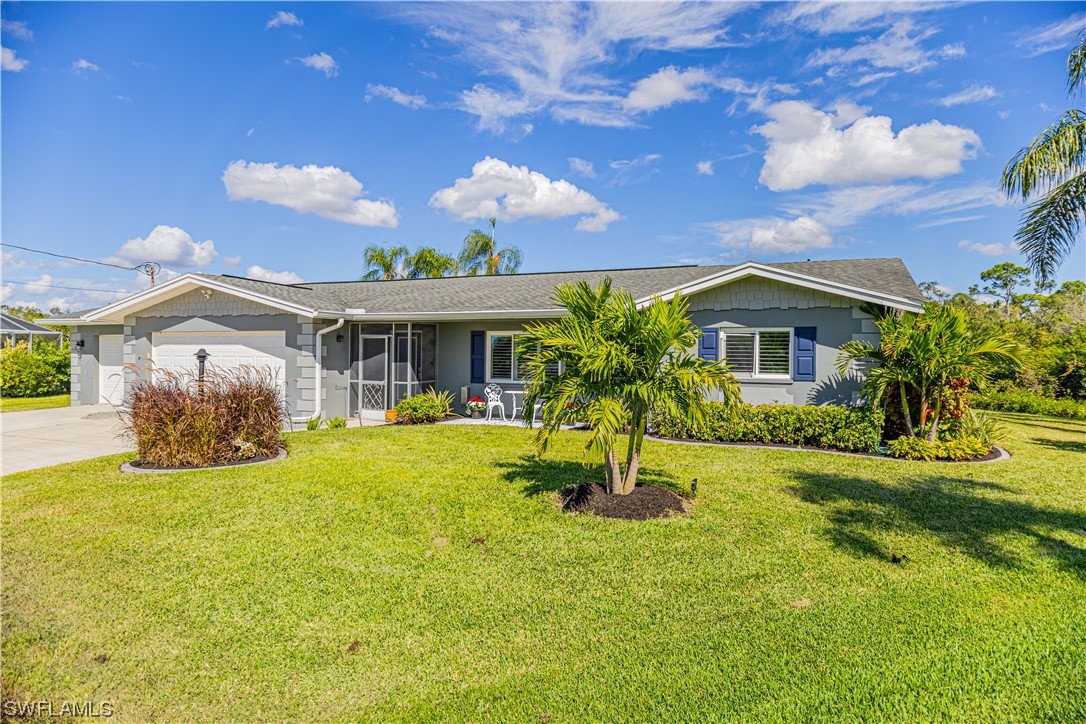 1753 Club House Road North Fort Myers, FL 33917 - Photo 4 of 24 a view of a house with a yard