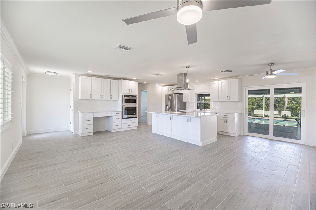 1753 Club House Road North Fort Myers, FL 33917 - Photo 7 of 24 a view of kitchen with wooden floor