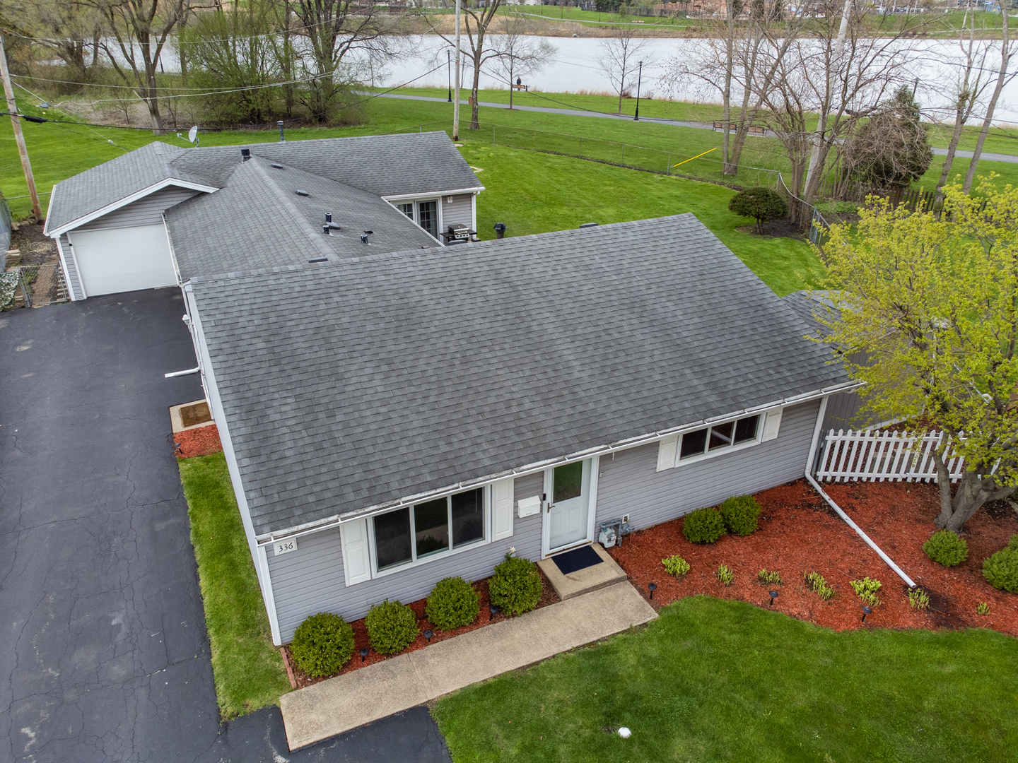 336 Sunset Lane Wheeling, IL 60090 - Photo 2 of 19 a aerial view of a house with yard and a patio