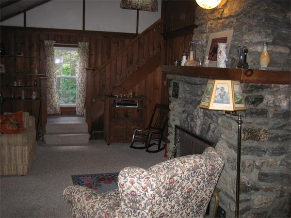 107 West Millbury Road Sutton, MA 01590 - Photo 17 of 26 a room with furniture and a fireplace