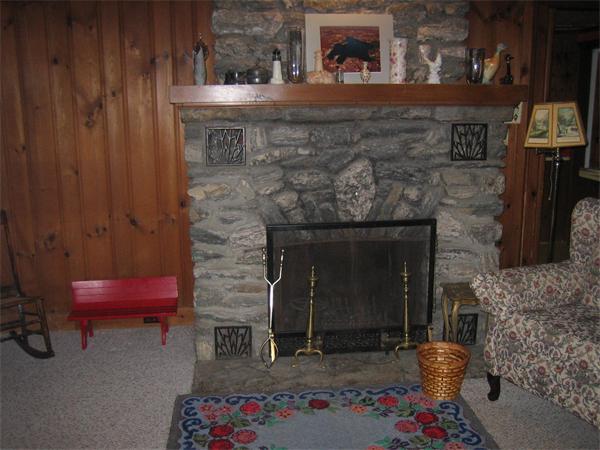 107 West Millbury Road Sutton, MA 01590 - Photo 18 of 26 a room with furniture and a fireplace