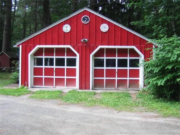 107 West Millbury Road Sutton, MA 01590 - Photo 3 of 26 a view of a large brick building with a yard