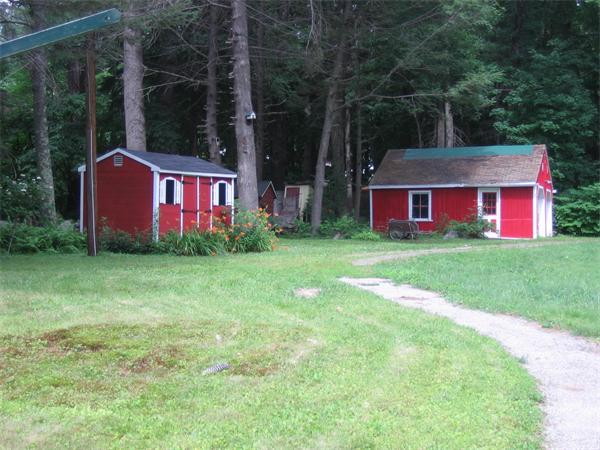107 West Millbury Road Sutton, MA 01590 - Photo 6 of 26 a front view of house with yard and trees in the background