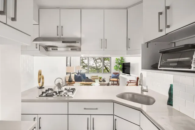 a living room with dining table and chairs