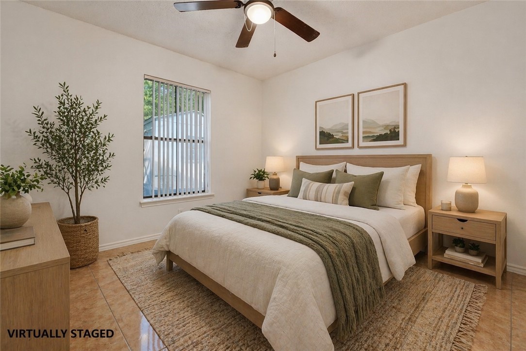 2328 Timberleaf Circle Ingleside, TX 78362 - Photo 17 of 33 a bedroom with bed and a potted plant
