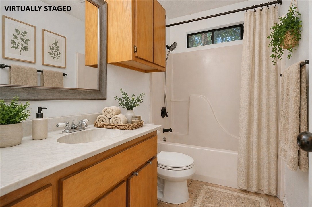 2328 Timberleaf Circle Ingleside, TX 78362 - Photo 20 of 33 a bathroom with a granite countertop sink a toilet and shower