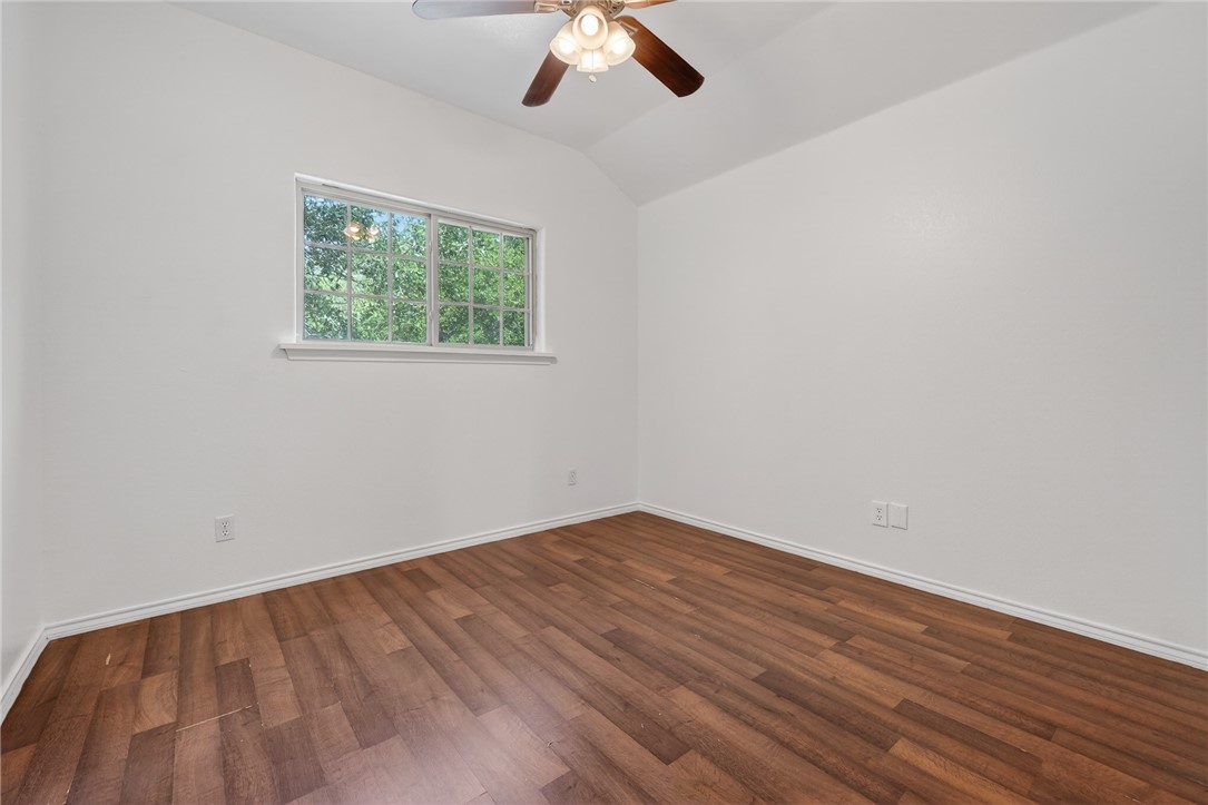 2328 Timberleaf Circle Ingleside, TX 78362 - Photo 22 of 33 an empty room with a window and a ceiling fan