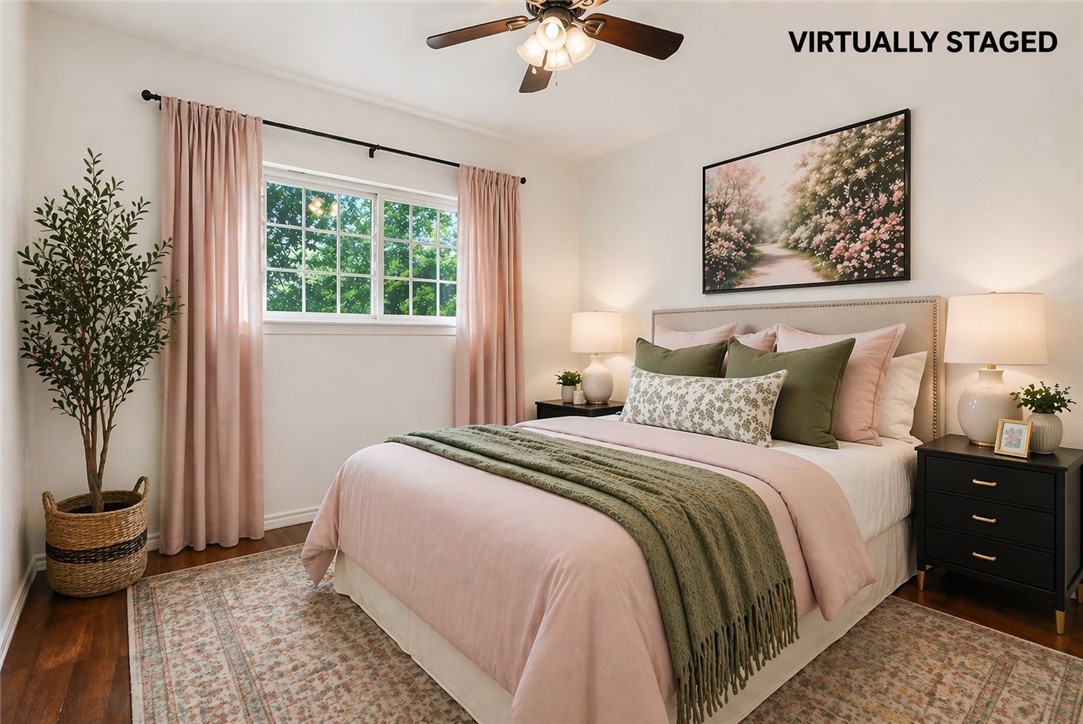 2328 Timberleaf Circle Ingleside, TX 78362 - Photo 23 of 33 a bedroom with a bed and a chandelier