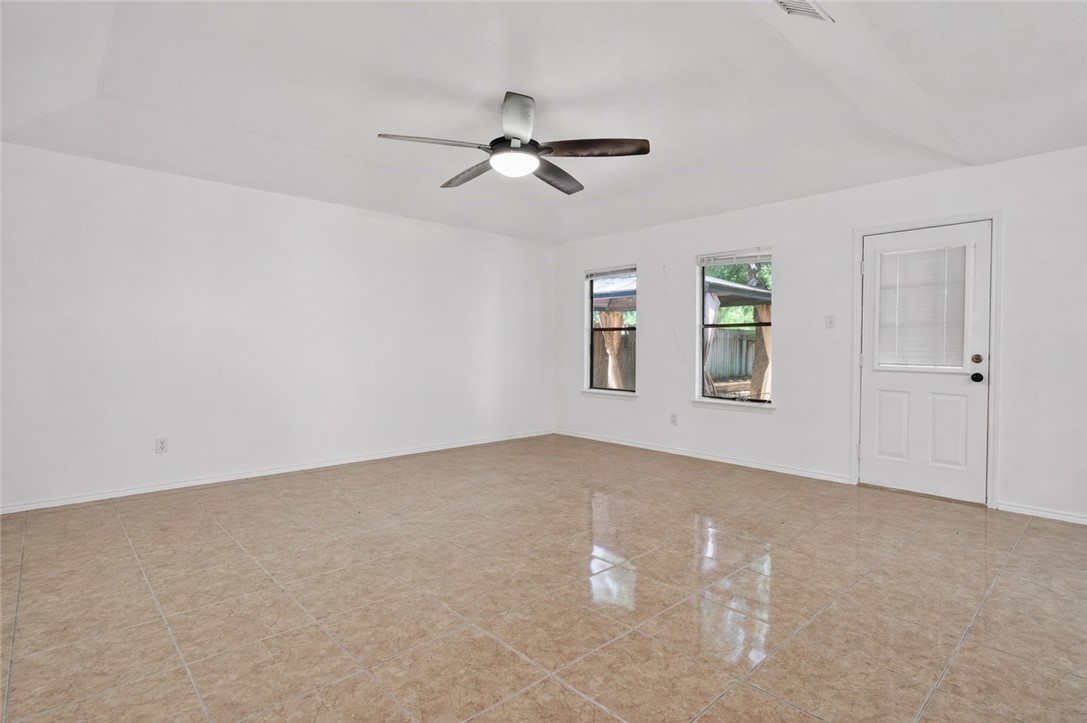 2328 Timberleaf Circle Ingleside, TX 78362 - Photo 3 of 33 a view of a livingroom with a ceiling fan and window