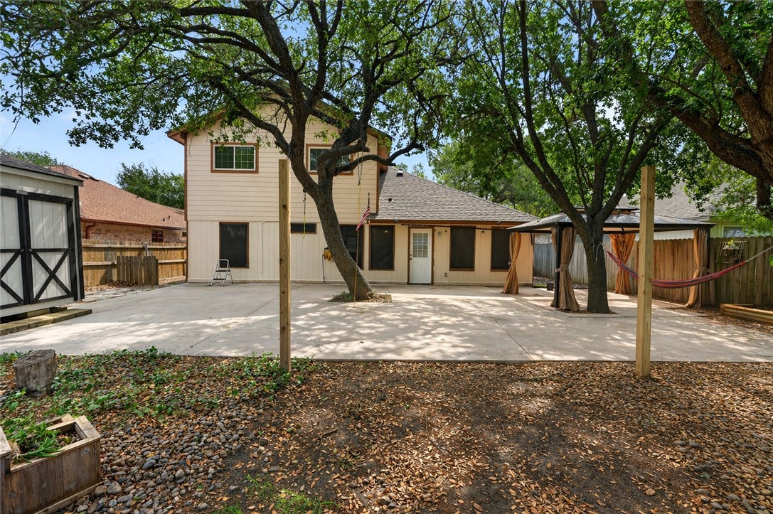 2328 Timberleaf Circle Ingleside, TX 78362 - Photo 32 of 33 a view of a yard in front of a house with large tree