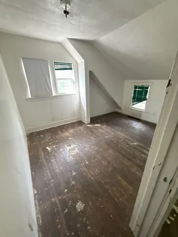 a view of empty room with windows