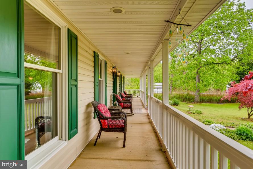 2231 Holly Neck Road Baltimore, MD 21221 - Photo 3 of 40 Relax on the covered front wrap-around porch