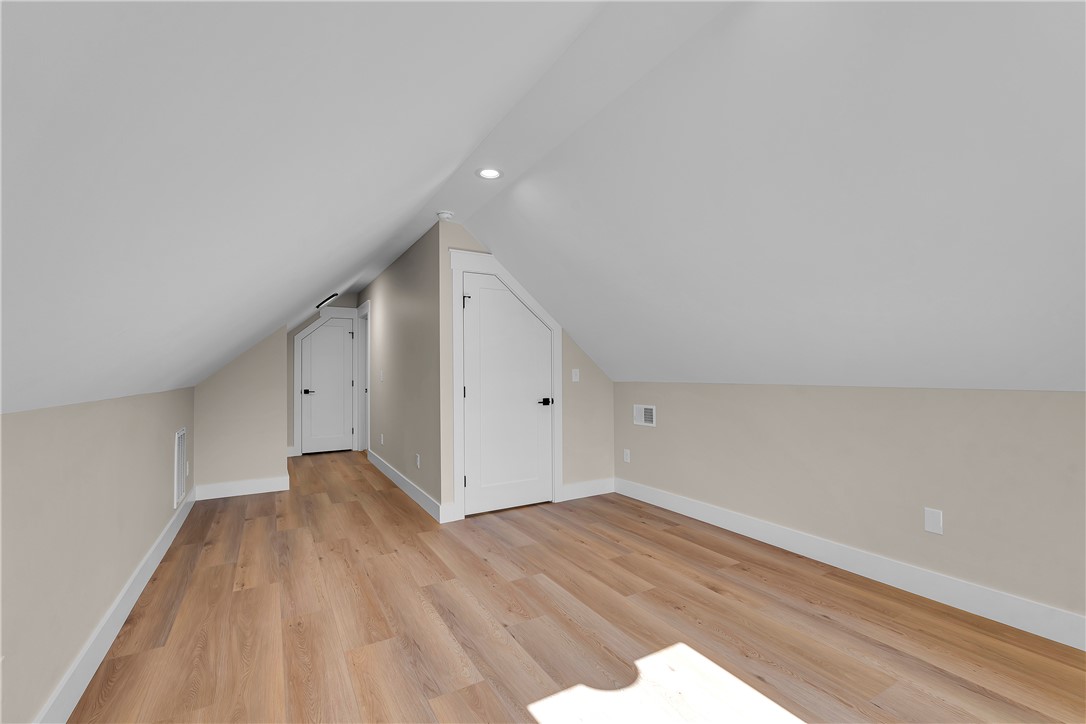 2816 Smith McGee Road Iva, SC 29655 - Photo 25 of 25 A versatile attic space provides additional storage with sloped ceilings and easy-care laminate flooring.